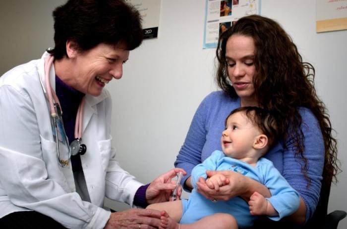 infant-being-held-by-his-mother-while-receiving-an-intramuscular-vaccination-in-his-left-thigh-muscle-850x562.jpg