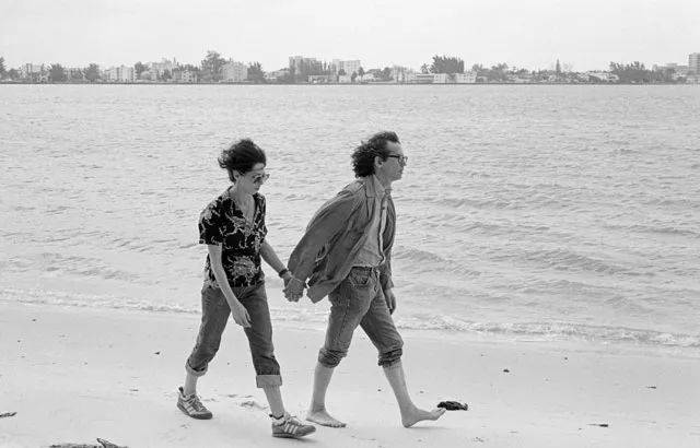 Christo and Jeanne-Claude working on the Surrounded Islands project. 1983. Photo: Wolfgang Volz<br>