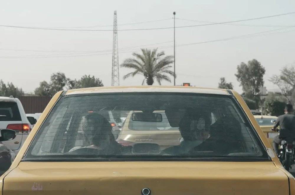巴格达卡拉达，出租车与椰枣树