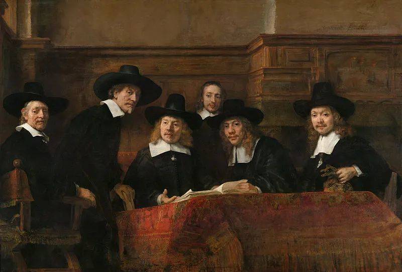 《布尔公会的理事》（<em>The Syndics of the Amsterdam Drapers' Guild</em>），伦勃朗绘于1662年。图中人物为布商，他们被推选对织工向行会成员提交的布匹进行检查（来源：commons.wikimedia.org）<br>