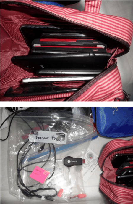 执法人员查获的手机，其中一个袋子上写着“一次性手机”