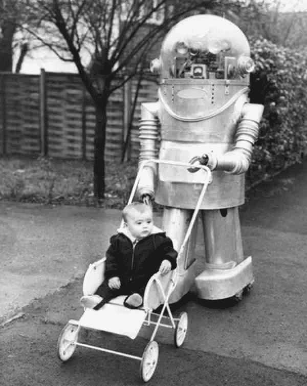 ■ 1967年，英国发明家丹尼斯·韦斯顿的机器佣人廷克（Tinker）在利兹的街道上推着婴儿车。这个机器人有1个电子眼、120 个电动机和 180 多个动作，都在遥控器的指挥下工作。当然，这样的设备将使未来生活变得更轻松。